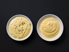 Bowls of Béarnaise and Hollandaise sauce