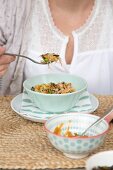 Woman eating vegetarian dish