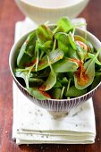 Spinach salad with an orange and pepper dressing