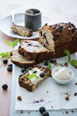 Banana bread with blueberries and white chocolate served with cinnamon and honey cream