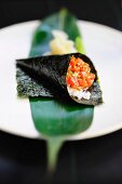 Temaki sushi with salmon and sesame seeds