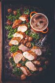 Glazed pork tenderloin with green cabbage and chestnuts