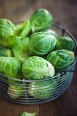 Fresh brussels sprouts in a wire basket