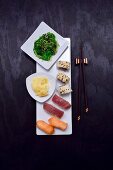 A sushi platter with pickled ginger and an algae salad (Japan)