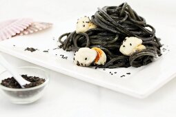 Squid noodles with mussels and sesame seeds