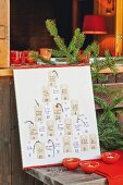 Advent calendar with hand-written, personal gift cards hand-made from paper tags