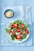 Strawberry salad with bacon, pearl beans, feta cheese, vegetables and strawberry jam