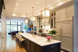 Dining table running into island counter in large kitchen