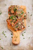 Sepia pasta fritters with chives and peppers