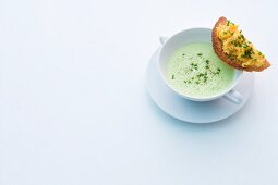 Foamy herb soup with egg crostini