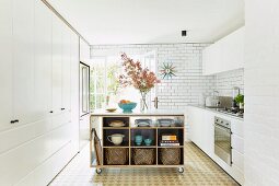 Mobile kitchen island with shelves in white kitchen