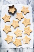 Pistachio star cookies being cut out