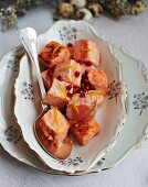Pickled salmon with lemon, vodka and pomegranate seeds