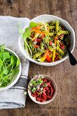 Pasta salad with fresh vegetables and goji berries