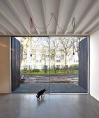 Minimalist interior with concrete floor and terrace doors