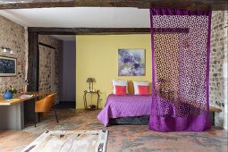 Yellow wall and stone walls in bedroom