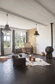Wood-burning stove and charcoal concrete floor in industrial-style interior