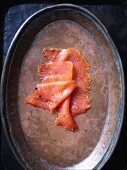 Thin slices of salmon on a copper plate