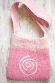 Hand-made pink felt bag with spiral motif