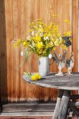 Yellow Easter arrangement of forsythia, narcissus and Easter eggs