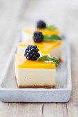 Mango mousse cake with blackberries