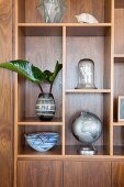 Various decorative objects on precious wood shelves