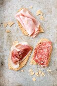 Crispy schiacciatine topped with salami, ham and mortadella