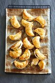 Puff pastry moons filled with lentils and raisins
