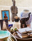 Porcelain jar, pen holder and ethnic objets d'art on desk