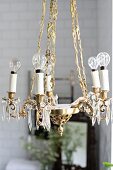 Vintage-style brass chandelier with light bulbs