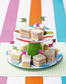 Min sandwiches with flags for a child's birthday party