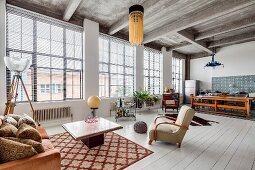 Ribbed concrete ceiling and white wooden floor in eclectic loft apartment