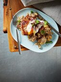 Spicy fried cauliflower with tahini, sesame seeds, tuna, and a poached egg