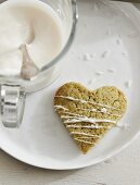 Heart-shaped cookies with matcha powder decorated with white chocolate