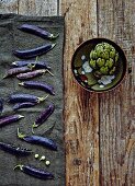 Purple pea pods and an artichoke