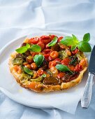 Tarte tatin with heirloom tomatoes and basil