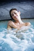 Woman relaxing in a hot tube