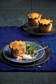 Mini pies with salmon, ricotta and capers