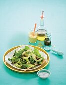 Green salad with courgettes, avocado, capers and a mustard vinaigrette