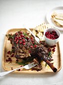 Slow-roasted leg of lamb with pomegranates and rosemary for Easter