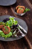 Quinoa fritters on a bed of lettuce