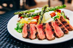 Grilled beef steak with asparagus salad