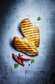 Two grilled chicken fillets (seen from above)