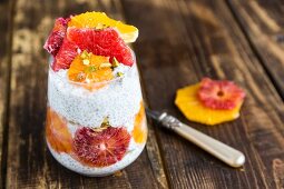 Chia pudding with orange and grapefruit slices in a glass