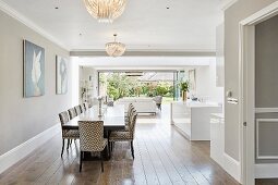 Dining table and glass wall in open-plan interior