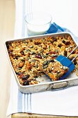Muesli bars with dried fruit on a baking tray
