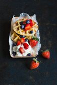 Churro waffles with fresh berries and cream