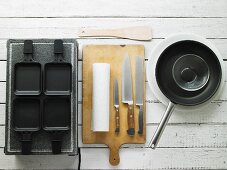 Utensils and kitchen implements for raclette