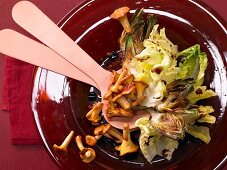 Warm chanterelle mushroom salad with artichokes and walnut oil