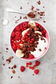 Chocolate muesli with oats, flaked almonds, yoghurt, bananas and berries